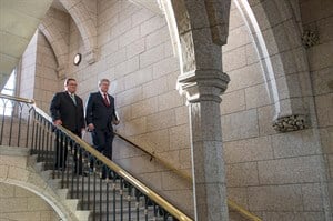 Prime Minister Stephen Harper arrives with Finance Minister Jim Flaherty as he enters the House of Commons to table the budget on Parliament Hill in Ottawa on Tuesday, Feb. 11, 2014. (THE CANADIAN PRESS/Justin Tang)