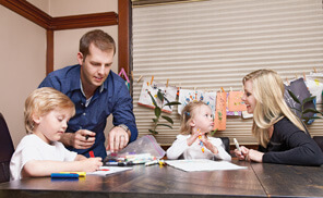 Greg Harris of Toronto (pictured here with his wife Anissa and their two kids) received a loan for a university education from his parents. (Photograph by Lisa Petrole)