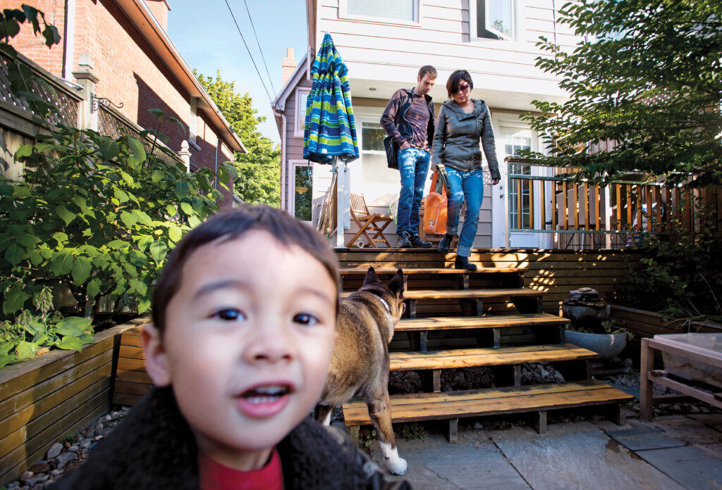 Morning ritual: Husband Kevin leaves for work as Tina Jones takes 3-year-old Leo to a local daycare in Toronto. (Photograph by Darren Calabrese)