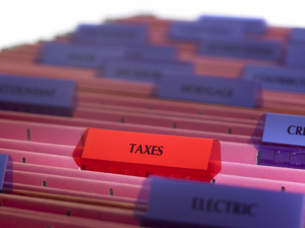 Real estate investors need to gather receipts at tax time (jonathansloane /Getty Images)