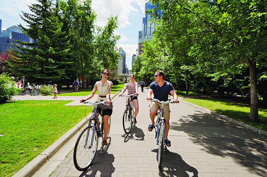 Eau Claire residents bike through Prince’s Island Park (Tourism Calgary)