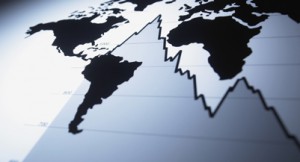 World map on descending line graph investing outlook
