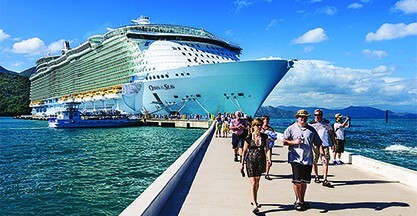 Passengers disembark the Royal Caribbean Cruise ship the Oasis of the Seas for a day of beach activities.  With a passenger capacity of over six thousand, the Oasis of the Seas is the largest cruise ship in the world to date.