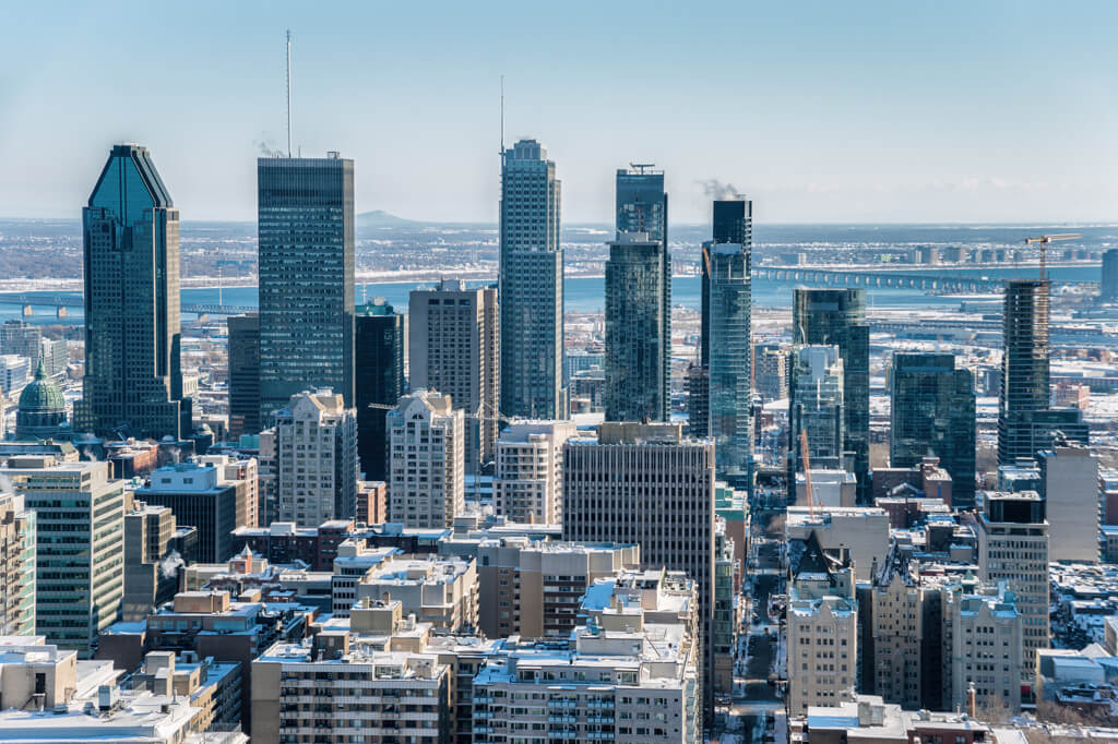 Montreal Skyline from Kondiaronk Belvedere / Mont-Royal. (Marc Bruxelle/Shutterstock) where to buy montreal real estate