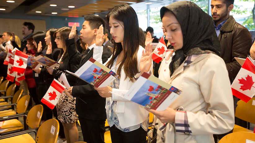 Oct 6 2015--Vancouver BC--Citizenship ceremony: New Canadians take the citizenship oath during a ceremony in Vancouver. (Photographs by Brian Howell)