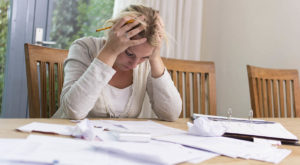 Woman worried about financial problems. paying taxes