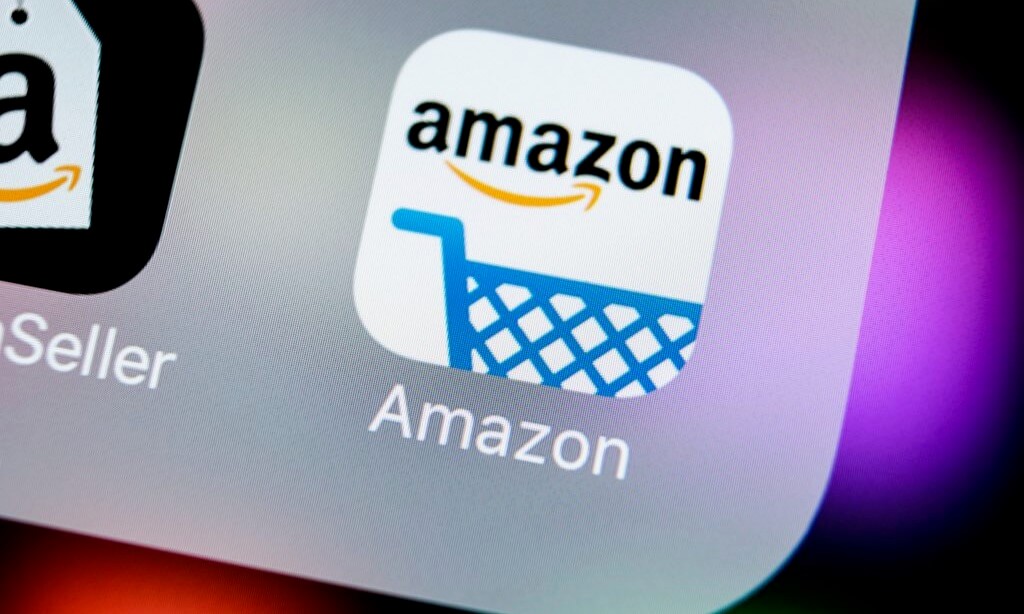 A photo of the Amazon logo is seen on a screen