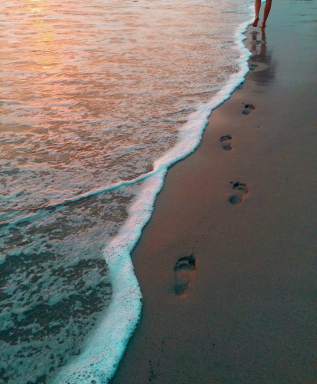 beach footsteps walking towards retirement