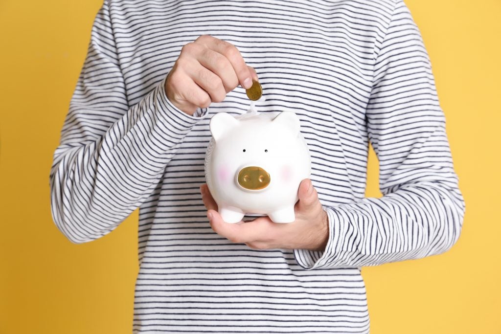 young person piggy bank