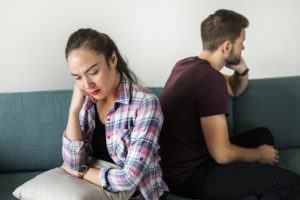 Unhappy couple not talking to one another