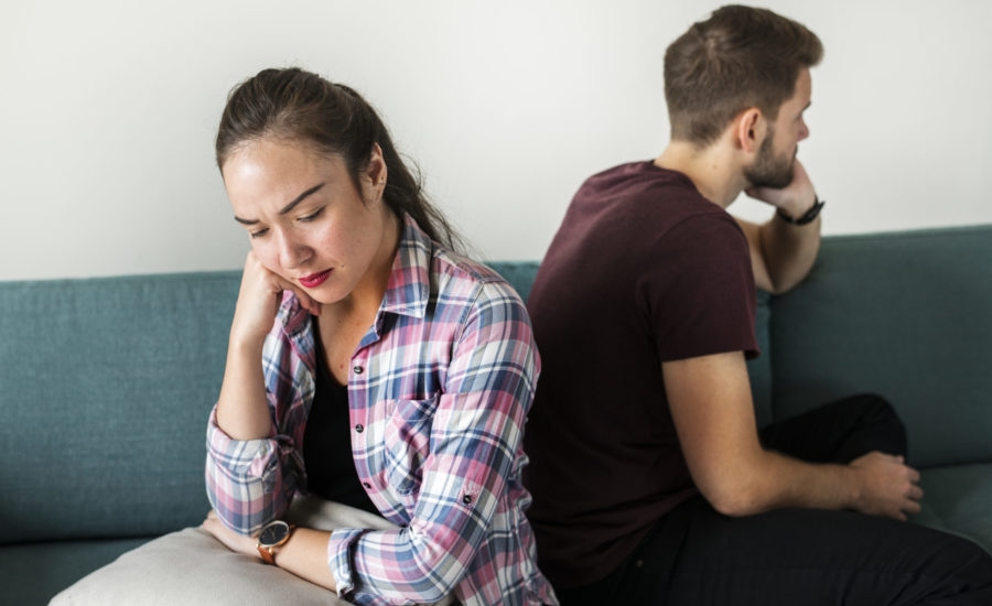 Unhappy couple not talking to one another