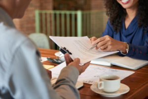 Man consulting with lawyer before signing contract