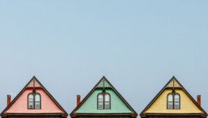 Three homes shown with pointed roofs