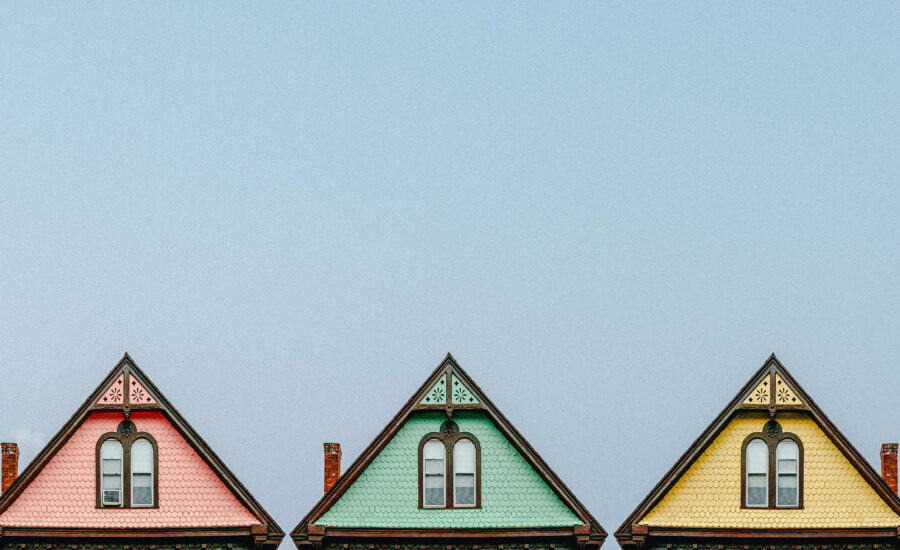 Three homes shown with pointed roofs