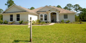 A home with a for sale sign, which is what many people might consider with the mortgage payment deferral deadline looming.