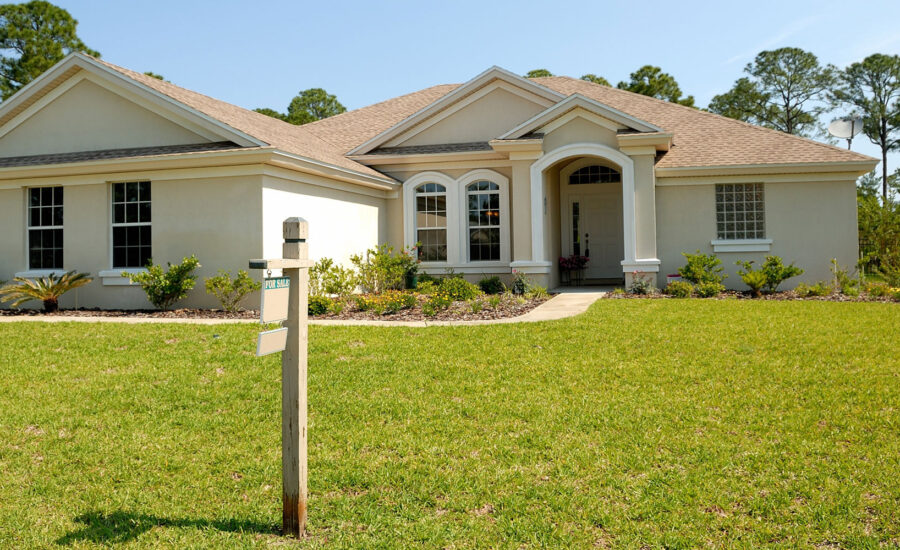 A home with a for sale sign, which is what many people might consider with the mortgage payment deferral deadline looming.