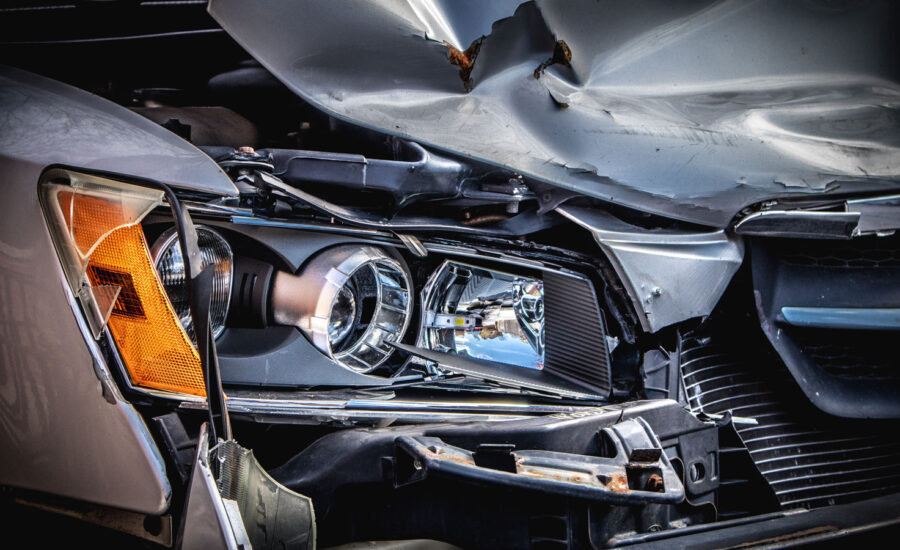 The bent-in frontend of a car after an accident