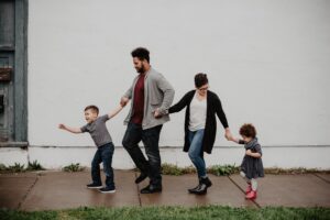 young family walking hand-in-hand