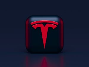 Tesla logo in red on black