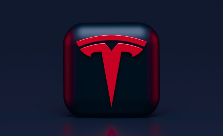 Tesla logo in red on black