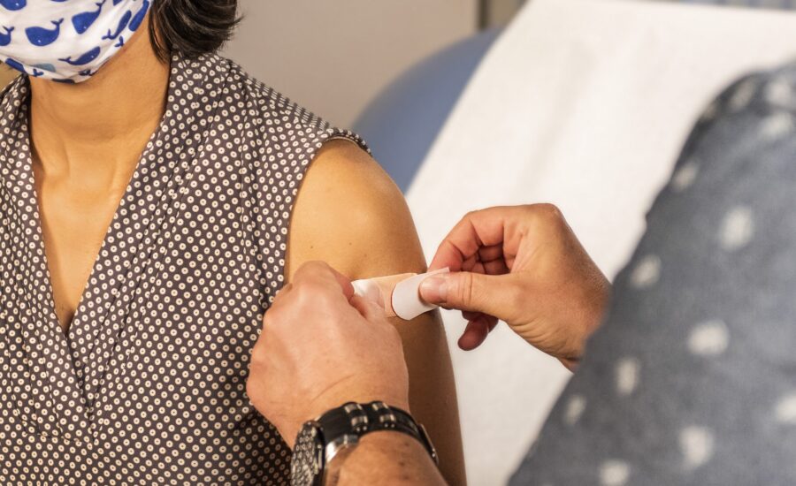 band-aid applied to upper arm following vaccine