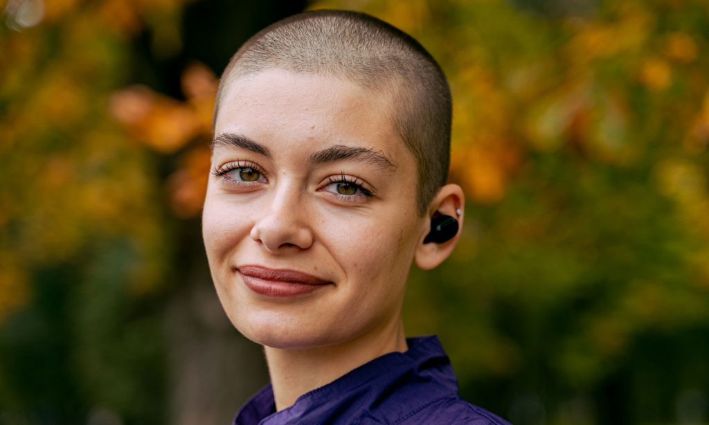 A woman after cancer treatment going for a walk on a beautiful fall day