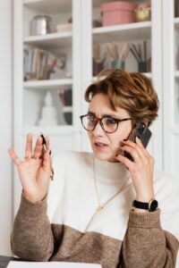 woman on phone with a concerned expression