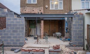 A home being rebuilt after substantial structural damage.