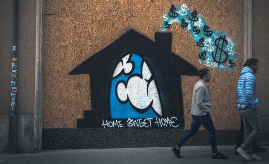 graffiti drawing of a home with dollar signs coming out of the chimney