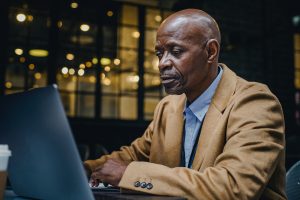 older man at laptop computer