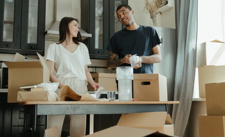 woman and man packing boxes for move
