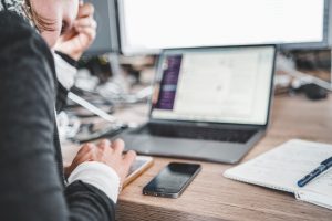 person studying information on laptop computer