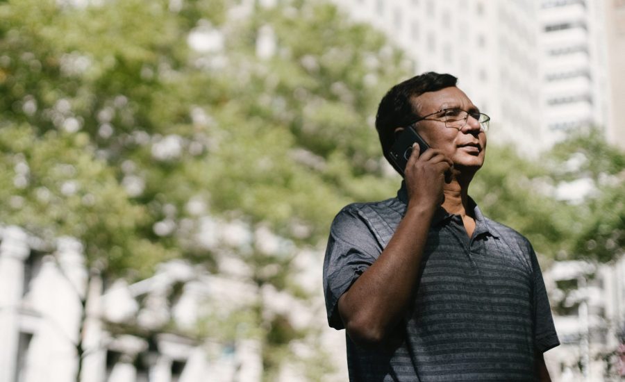 older man speaking on mobile phone