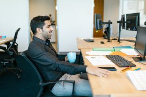 smiling man at desk