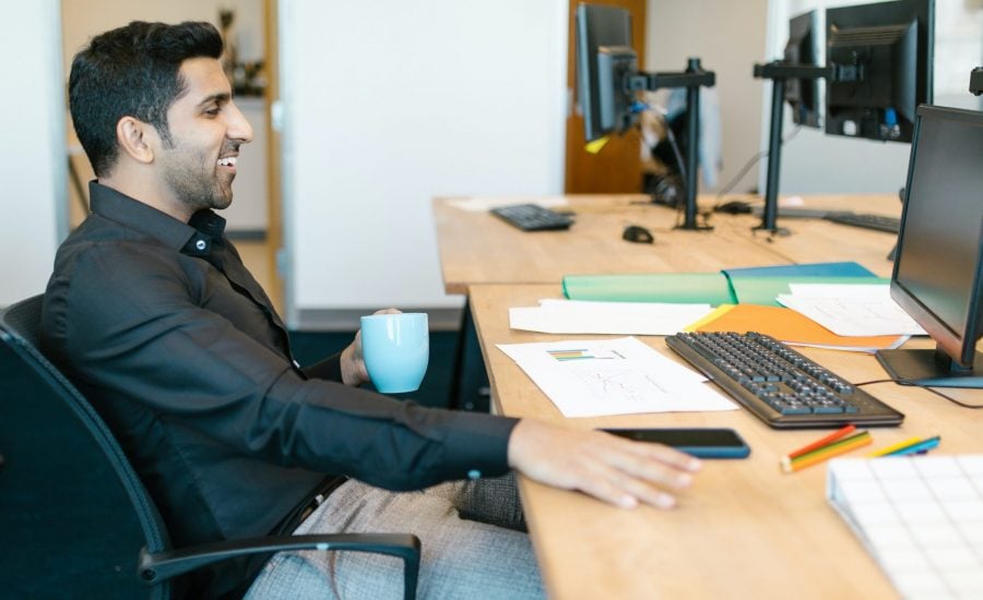 smiling man at desk