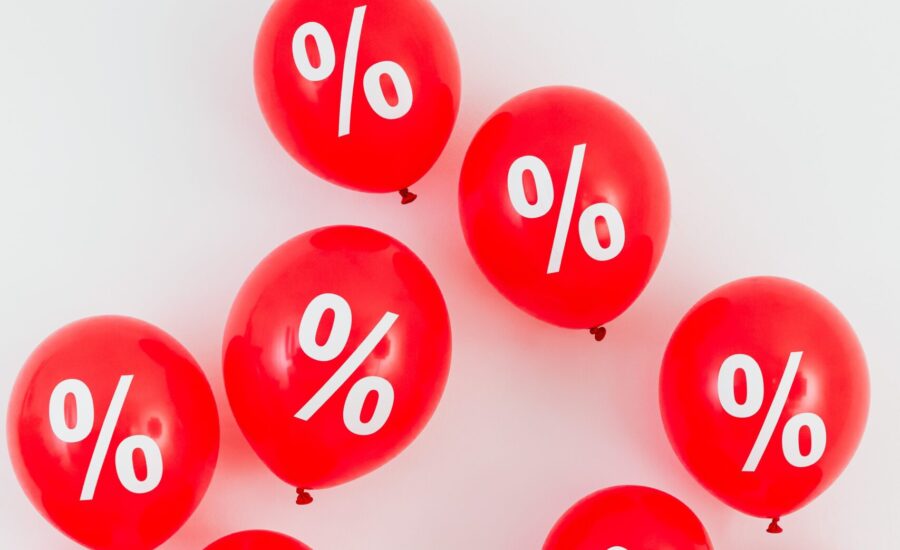 red balloons printed with percentage signs