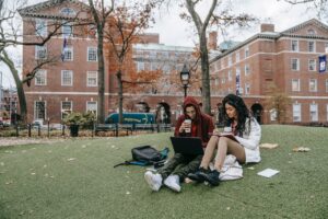 student money guide students studying on campus