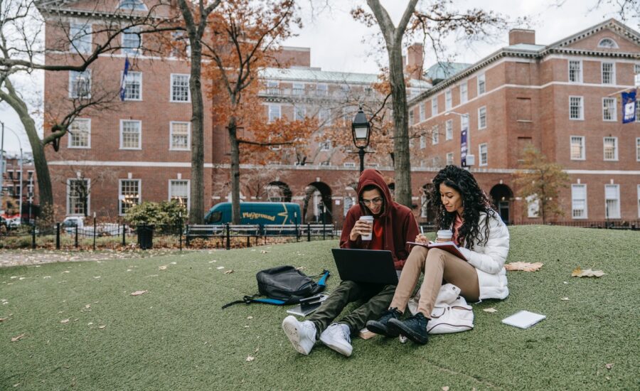 student money guide students studying on campus