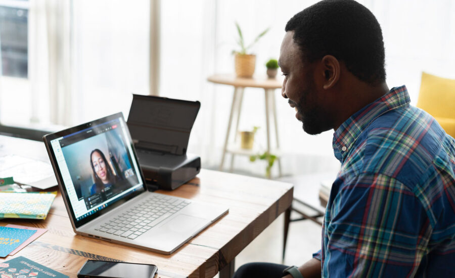 man on video call with coworker