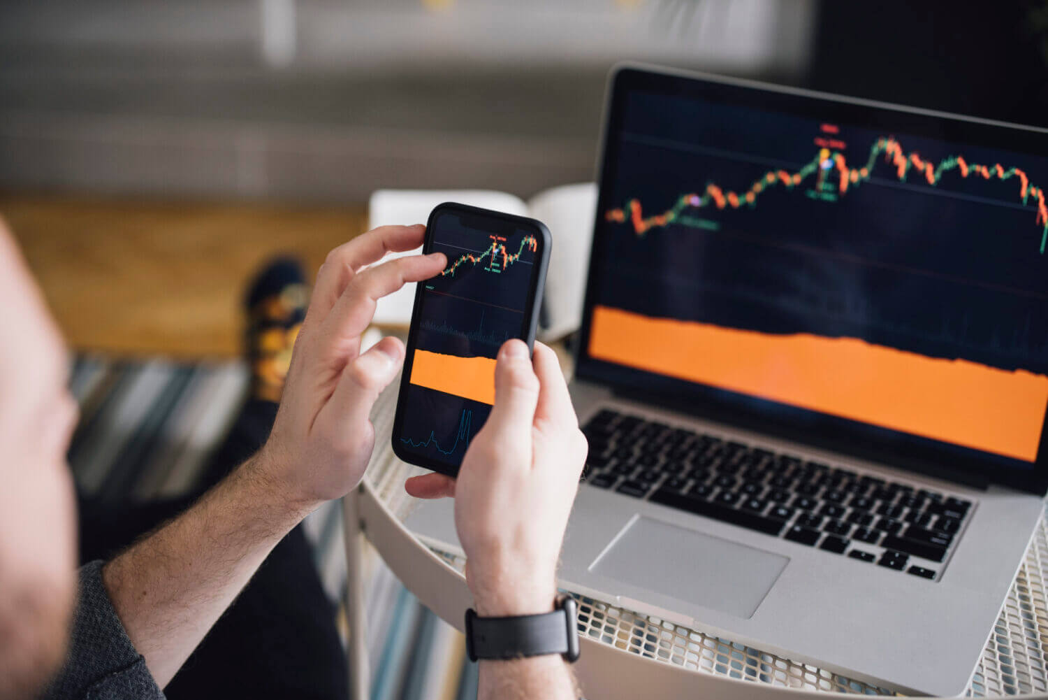 Work at home: Man Analyzing Crypto Graph On Laptop Screen