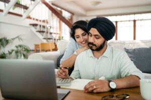 couple looking at laptop monitor