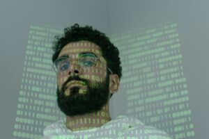 man with code projected on his face