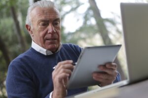 man checking investment statement