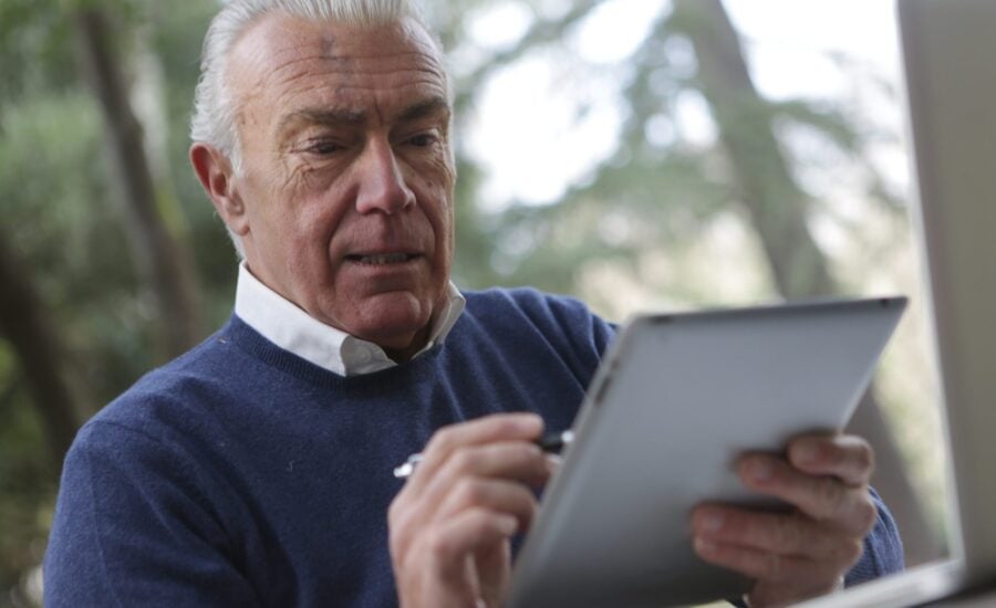 man checking investment statement