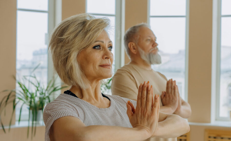 A couple enjoying a yoga class in their retirement