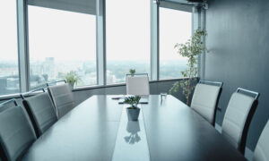 A boardroom window looking out into a snowy city