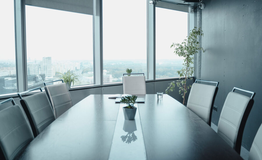 A boardroom window looking out into a snowy city