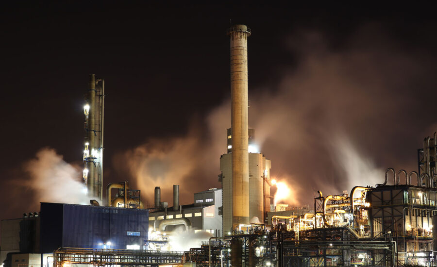 A factory building during night time