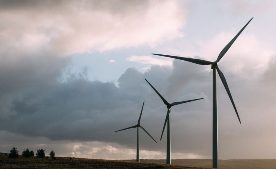 A valley of windmills can be seen on a sun rise