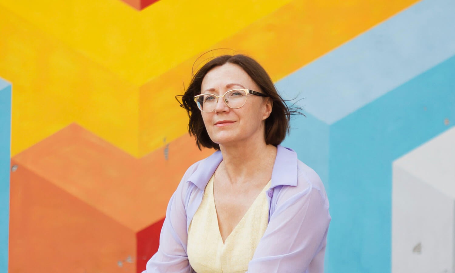 A woman approaching early retirement, smiling at her options.